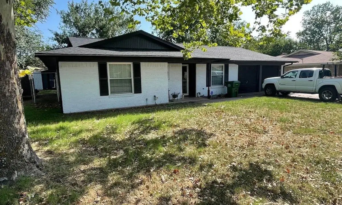 Professional roofing crew working on a residential roof in Massillon